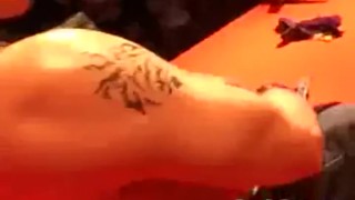 Two blonde strippers on stage teasing a horny guy