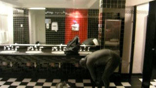 Thief changes into fully lubed rubber gear in public washroom