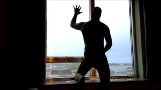 bad lighting but leopard jerking off in hotel window