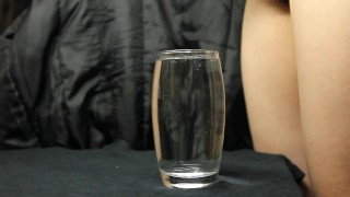 cumming in a glass of water