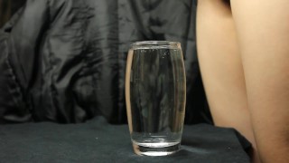 cumming in a glass of water