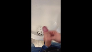boy jerking and cumming in urinal