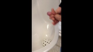 boy jerking and cumming in urinal