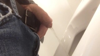 Pissing in urinal