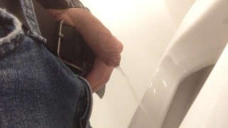 Pissing in urinal