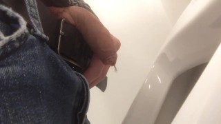 Pissing in urinal