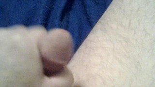 Cock playing with a red dildo