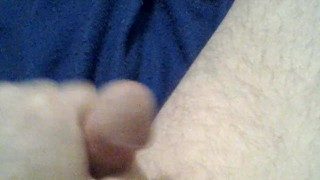Cock playing with a red dildo