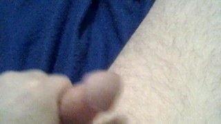 Cock playing with a red dildo