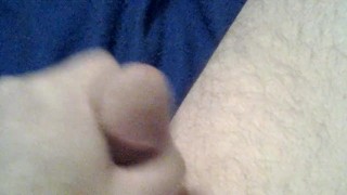 Cock playing with a red dildo