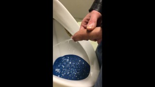 dirty boy pissing in dirty urinal