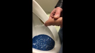dirty boy pissing in dirty urinal