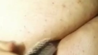 BBW fucking her ass with a hairbrush