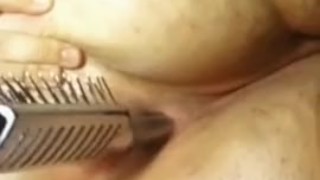 BBW fucking her ass with a hairbrush
