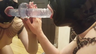 Amateur in Latex Hood Blowing a Dildo