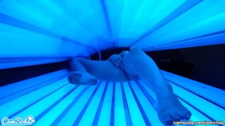 teen latina college student gives lesbian pussy a massage in tanning bed