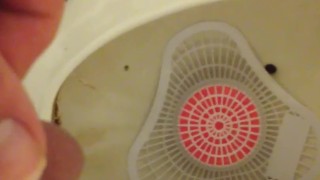 Pissing at the park urinal