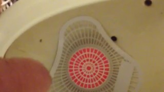 Pissing at the park urinal