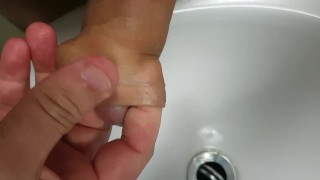 Pissing into my foreskin before massaging my glans to orgasm