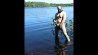 jerking off in lake wearing spandex tights, latex gloves and stocking mask
