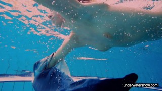 Teen girl Avenna is swimming in the pool
