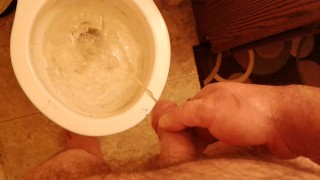 Pissing in a dirty toilet.