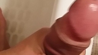 Stroking thick uncut cock