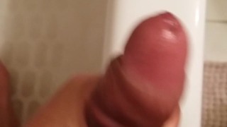 Stroking thick uncut cock