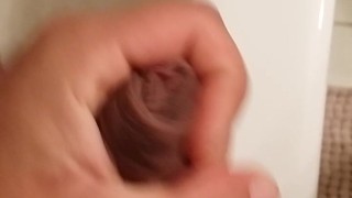 Stroking thick uncut cock