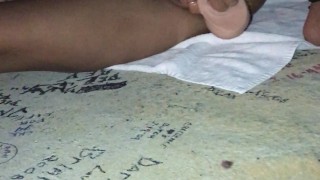 Asian fucking her toy with nipple clamps