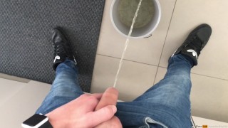 boy peeing in a bucket