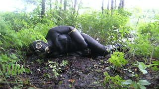 frogman quickly jerks off in shallow mud