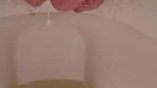 Playing with my hairy pussy while pissing on the toilet