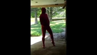 red zentai jerking off at garage door