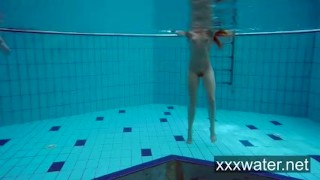 Milana and Katrin strip eachother underwater