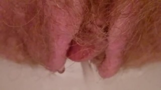 Powerful short piss from hairy (gingery) pussy
