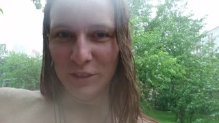 Public boobs flash outdoors in the rain