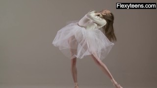 Blonde gymnast performs gymnastics