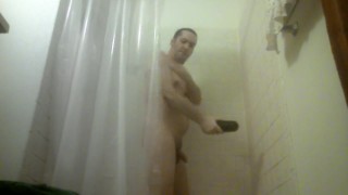 POV - Guy is playing with his flashlight in the shower