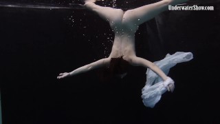 Redhead beauty in the white dress