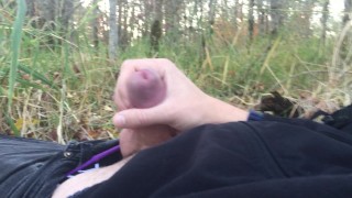 Young twink jerking off, cums in public park
