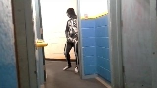 skeleton with hard on jerks off in gym hall