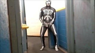 skeleton with hard on jerks off in gym hall
