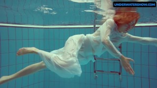 Redhead Diana hot and horny in a white dress
