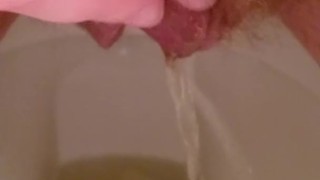 Close up hairy pussy piss and rub on toilet