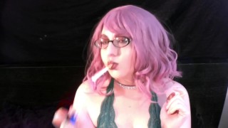 Coco smoking with pink hair and glasses