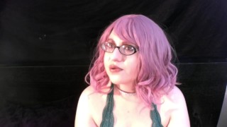 Coco smoking with pink hair and glasses