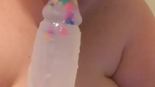 Watch this big girl swallow a cute dildo
