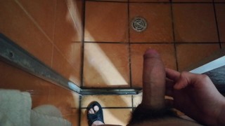 Guy peeing with boner