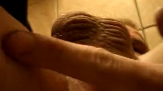 Stroking Cock and Asshole Fingering in Public Bathroom